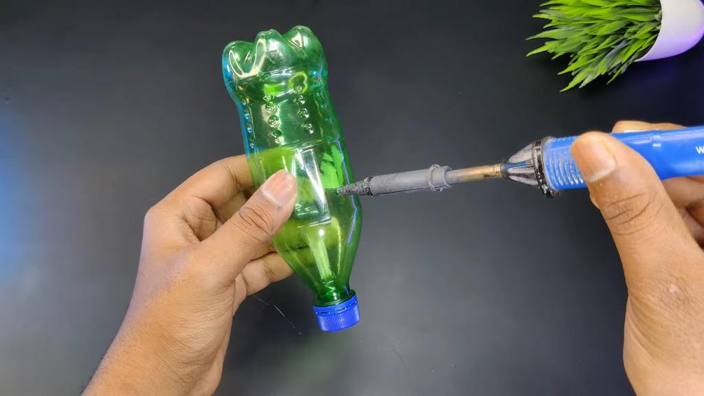 Drilling Holes in Plastic Bottles for Water Gun Assembly