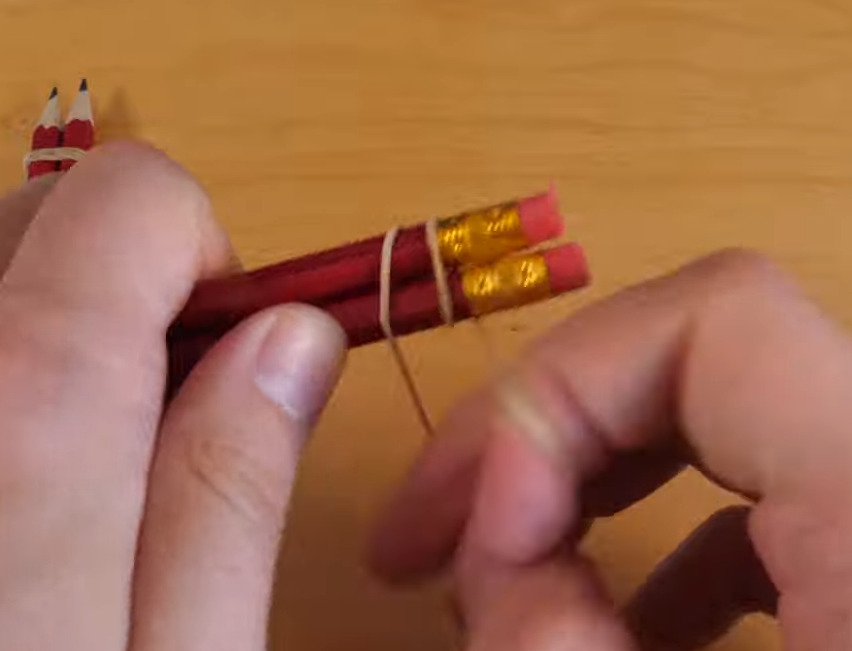 Joining Second Pair of Pencils with Rubber Bands