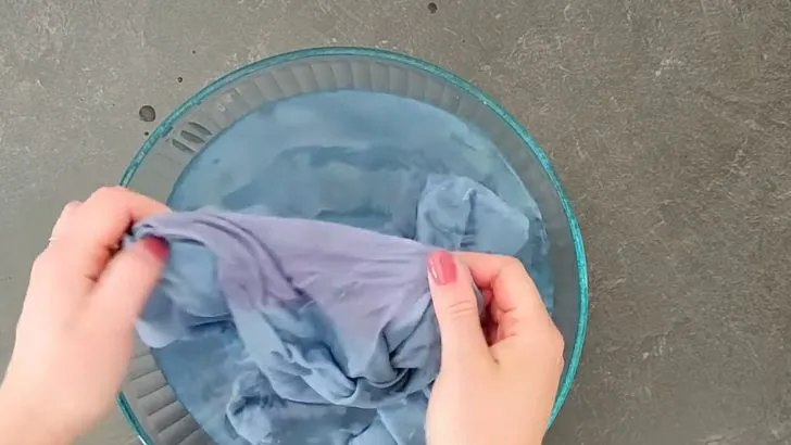 Rinse Stained Fabric Under Warm Water to Loosen