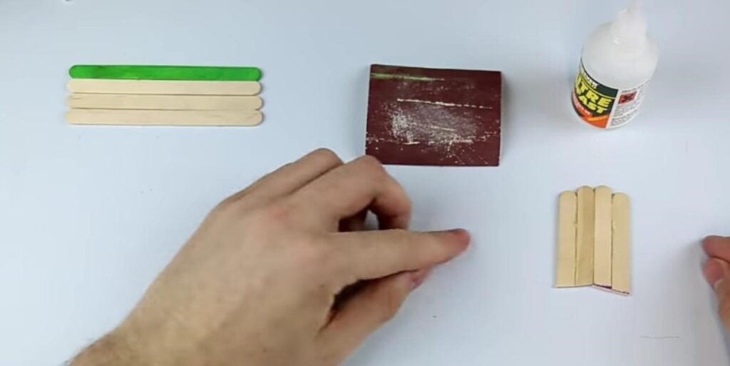  Sanding Ends of Cut Ice Cream Sticks for Sharp, Diagonal Points