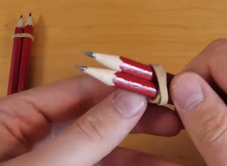 Securing Pointed Pencil Ends with Wider Rubber Band 